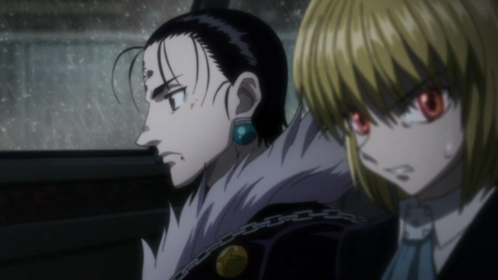 Kurapika and Chrollo are in a car, with Kurapika visibly angry.